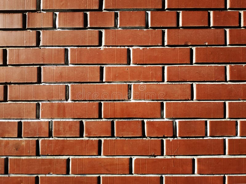 Glossy orange brick wall stock photo. Image of glossy 10518500
