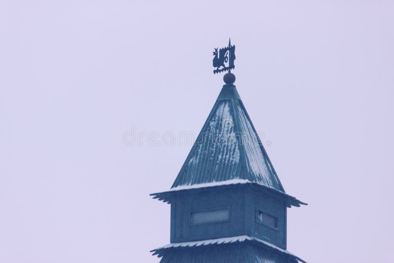 Brick round corner tower. Blue, church.