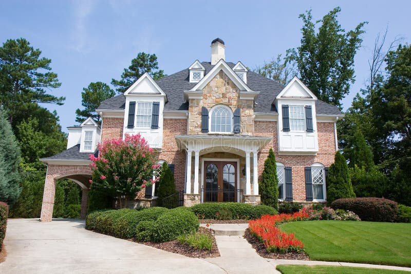 Brick and Stone House with Flowers