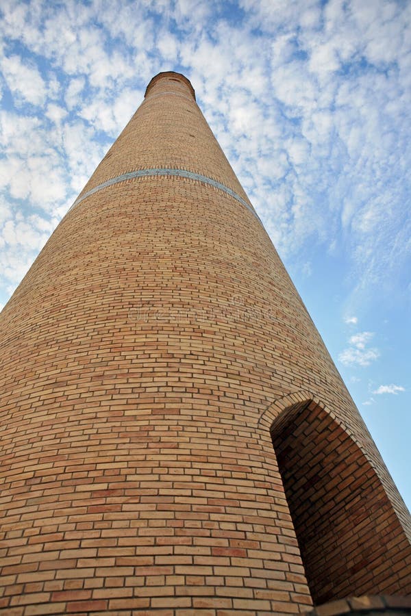 Brick tower scraping sky