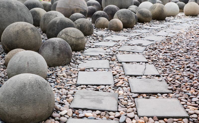 Brick walk way and ball rock royalty free stock photography