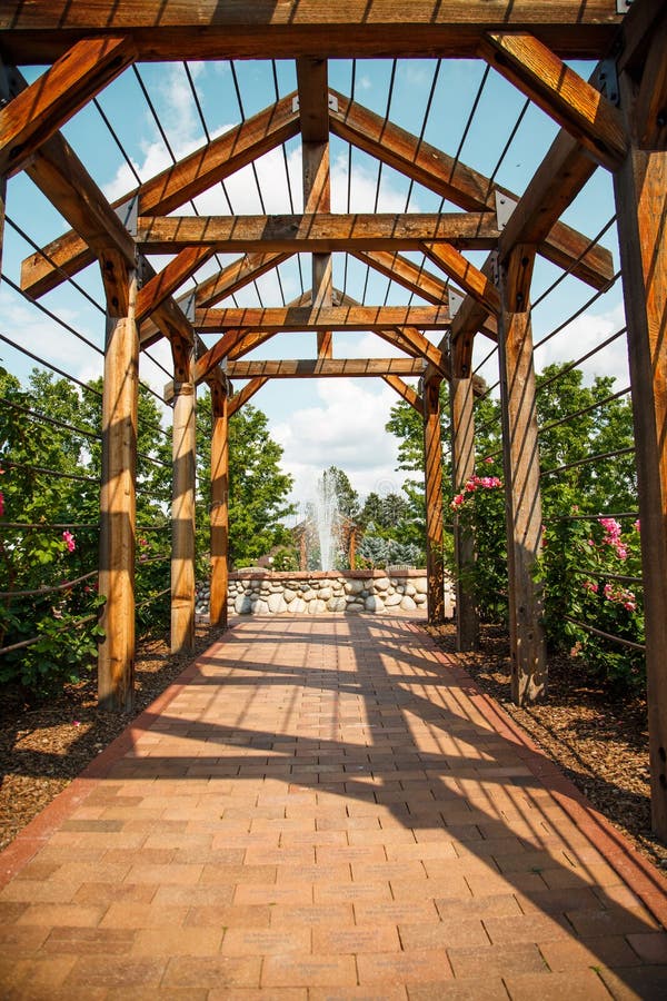 Brick Walkway Through Rose Arbor Toward Fountain Stock ...