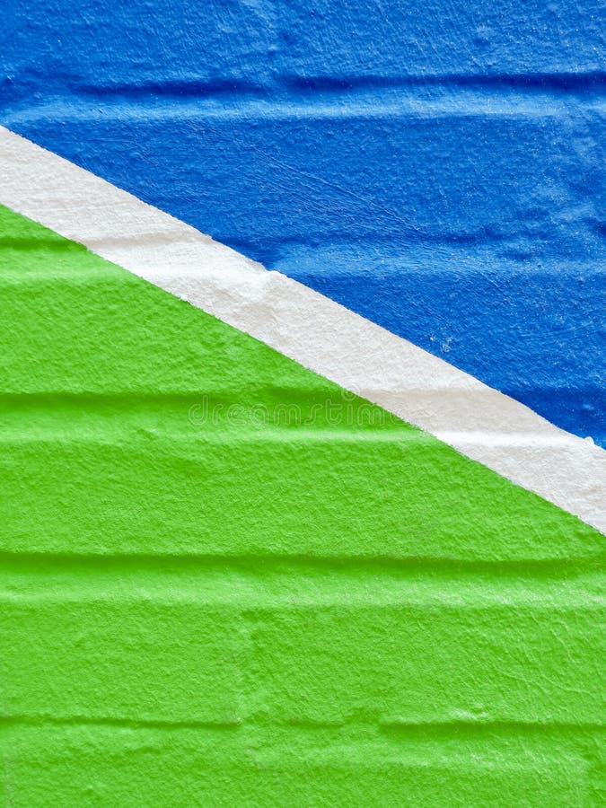 Brick Wall Coloured with Vibrant Blue and Green Colours Stock Photo