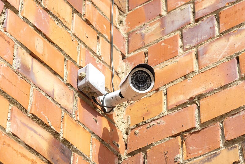 Brick Wall with Security Camera Set in the Corner Stock Photo Image