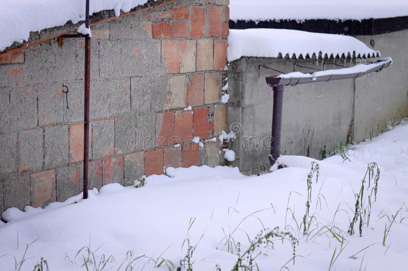 Brick wall and snowy path stock photo. Image of path 113364022