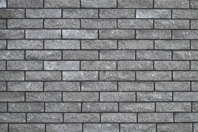 Brick wall texture, seamless stone pattern, gray brickwall, abstract grey background, urban design. House facade backdrop.