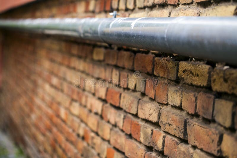 Brick Wall and Water pipe stock image. Image of antique 44468895