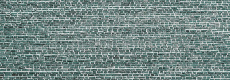 Brick wall, wide panorama of mint color masonry. Wall with small Bricks. Modern wallpaper design for web or graphic art projects.