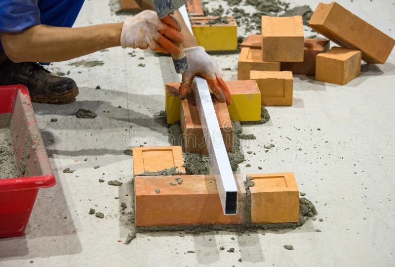 Bricklayer Installing Bricks, Bricklayer Worker Installing Brick Stock