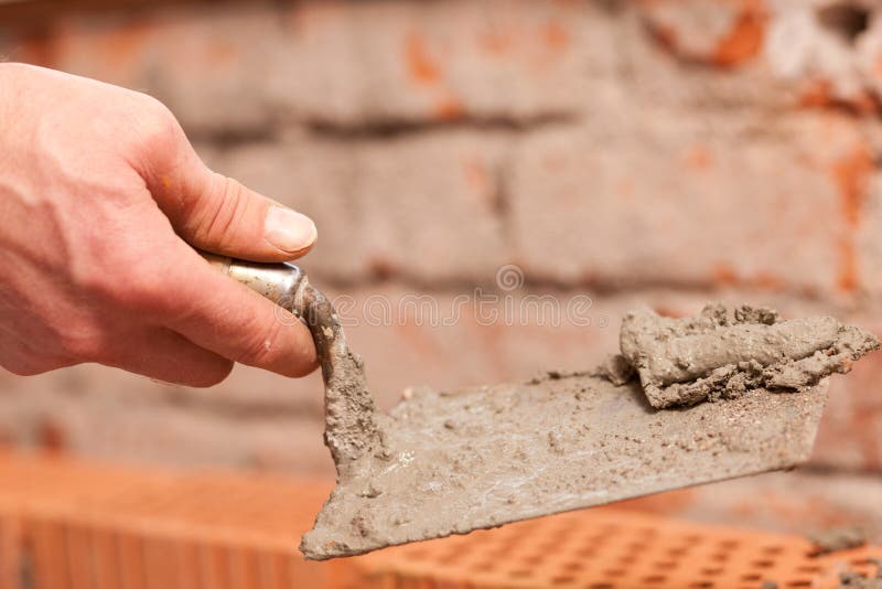 Bricklayer working on construction site royalty free stock photos