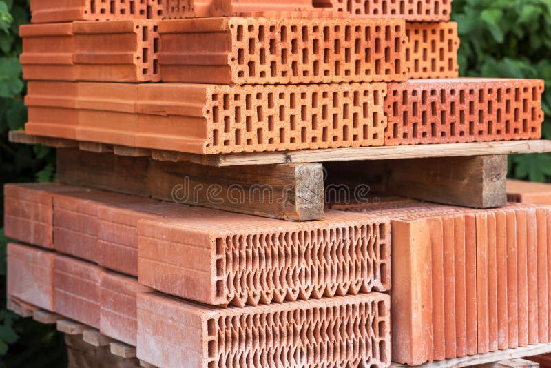 Bricks on pallet. Ceramic hollow brick blocks. stock images