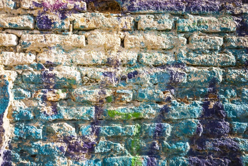 Bricks Wall Painted in Different Paint Pastel Colours. Stock Photo