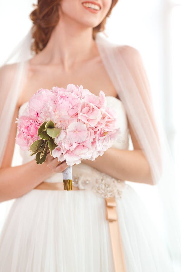 Bridal bouquet Beautiful of pink wedding flowers in hands of the bride stock images Bridal bouquet Beautiful of pink wedding flowers in hands of the bride stock images