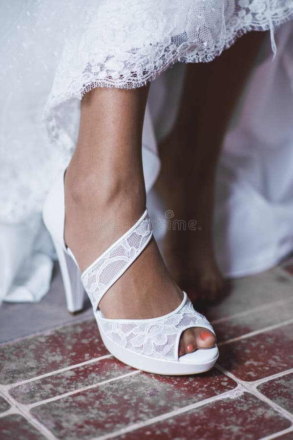 Bridal Shoes on Her Wedding Wearing on the Feet of the Bride Stock ...