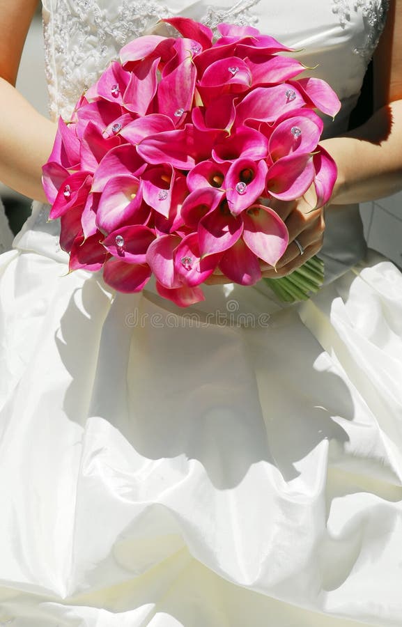 Bride on her wedding day holding a bouquet