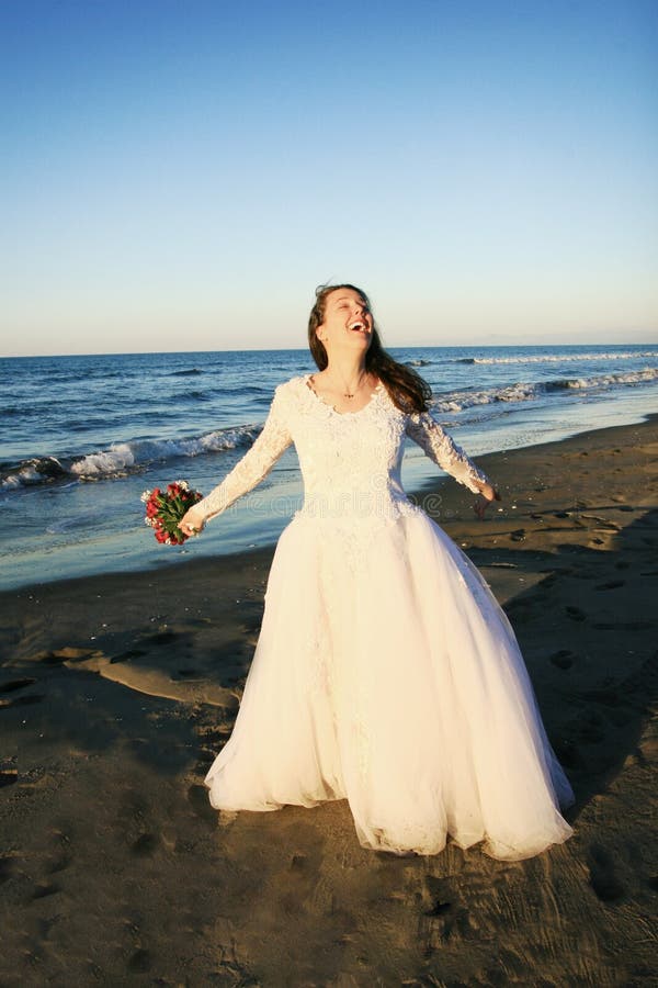 Bride at the beach royalty free stock image Bride at the beach royalty free stock image