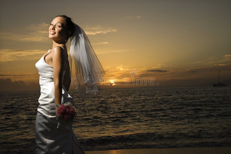 Bride on beach.