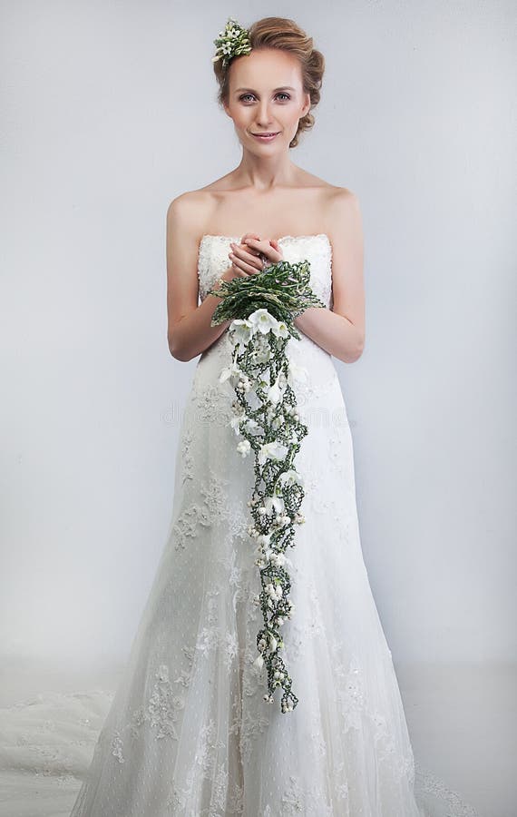 Bride blond with bouquet of flowers