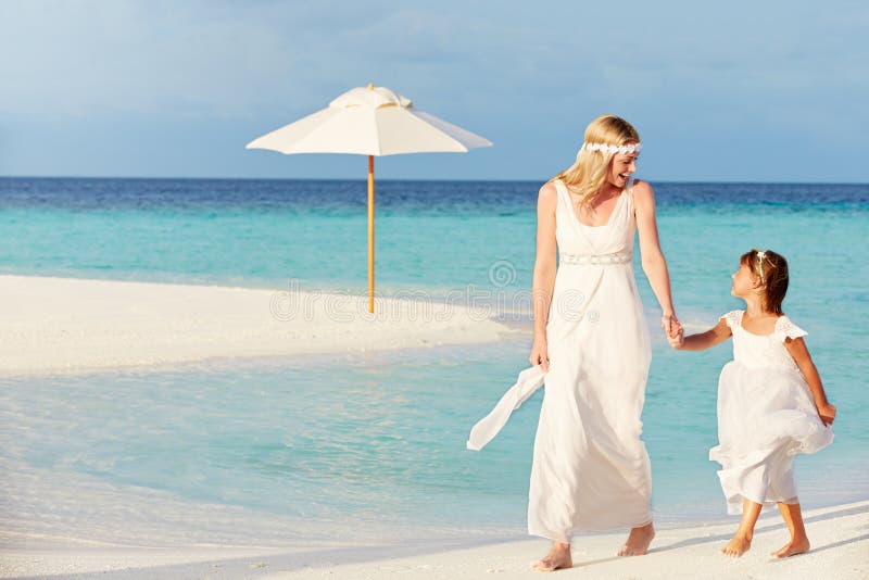 Bride With Bridesmaid At Beautiful Beach Wedding