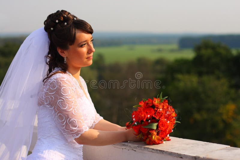 Bride with the bunch of flowers.