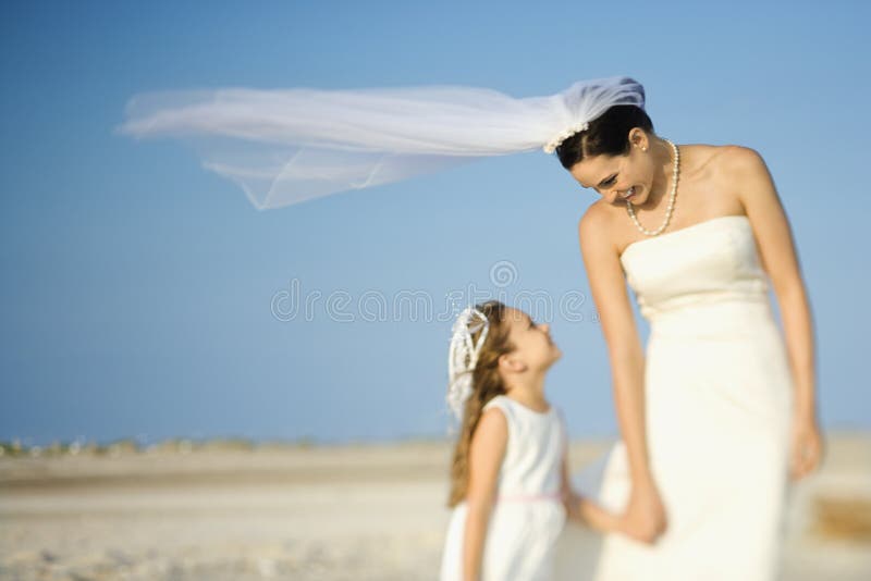 Bride and Flower Girl on Beach