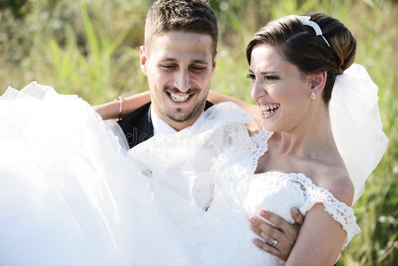 Bride and groom in a beautiful light holding hug royalty free stock photo Bride and groom in a beautiful light holding hug royalty free stock photo