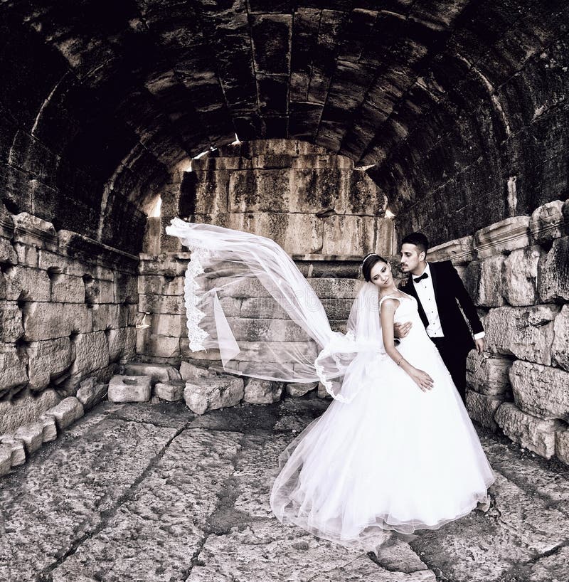 Bride and groom in a beautiful light holding hug stock photos Bride and groom in a beautiful light holding hug stock photos