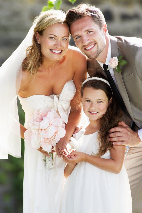 Bride And Groom With Bridesmaid At Wedding stock images
