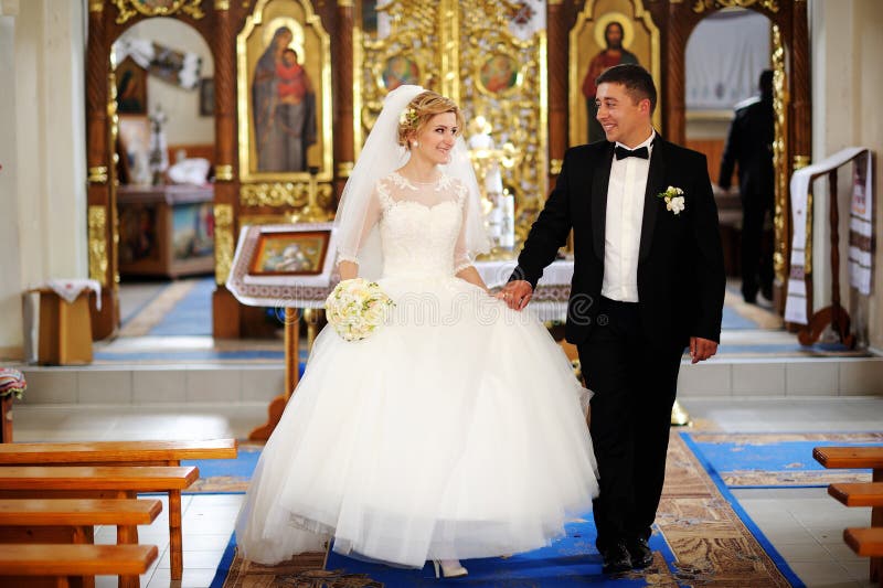 bride and groom at the altar, beautiful, black, catholic, commitment, dress, elegant, face, family, happiness, holding, ceremony, jewelry, bridal, lovely, beauty, relationship, religion, celebration, happy, wife, romantic, white, romance, wedding, married, female, marriage, engagement, woman, people, girl, couple, hand, together, caucasian, gold, bouquet, two, young, spouse, forever, tradition, flower, smile, church. bride and groom at the altar, beautiful, black, catholic, commitment, dress, elegant, face, family, happiness, holding, ceremony, jewelry, bridal, lovely, beauty, relationship, religion, celebration, happy, wife, romantic, white, romance, wedding, married, female, marriage, engagement, woman, people, girl, couple, hand, together, caucasian, gold, bouquet, two, young, spouse, forever, tradition, flower, smile, church