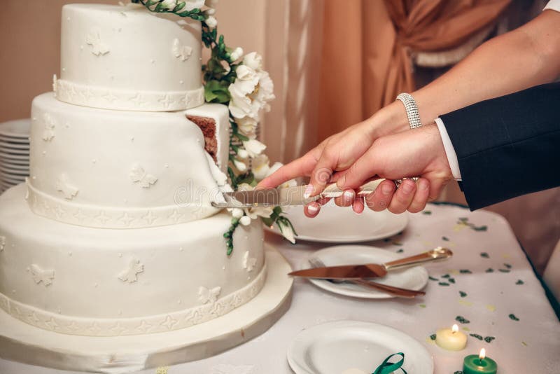Bride and Groom Cutting the Wedding Cake stock photos Bride and Groom Cutting the Wedding Cake stock photos