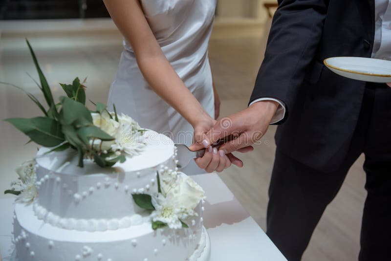 Bride and Groom Cutting Wedding Cake Together Stock Image Image of