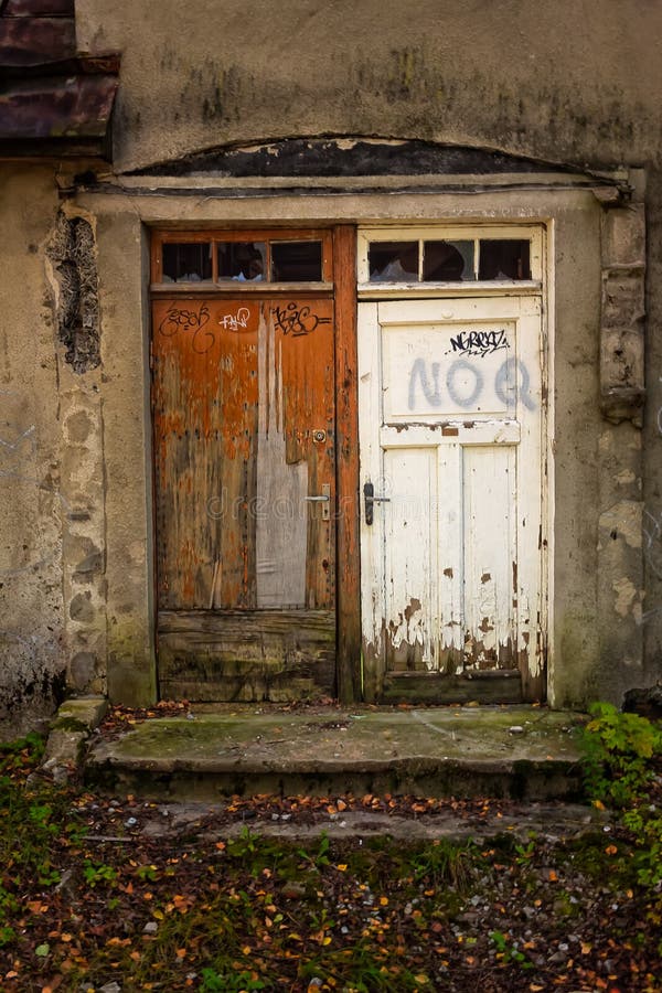 Bride And Groom Doors. Two doors on an old abandoned building in the area of Nomme in Tallinn, Estonia. They look like a bride and a groom in a strange wedding royalty free stock photos Bride And Groom Doors. Two doors on an old abandoned building in the area of Nomme in Tallinn, Estonia. They look like a bride and a groom in a strange wedding royalty free stock photos
