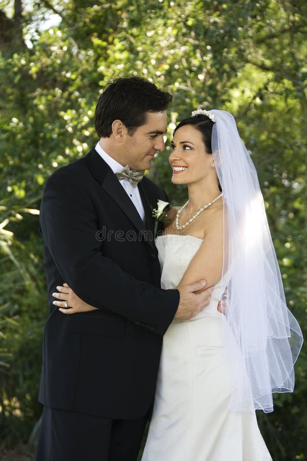 Bride and groom embracing. stock image Bride and groom embracing. stock image