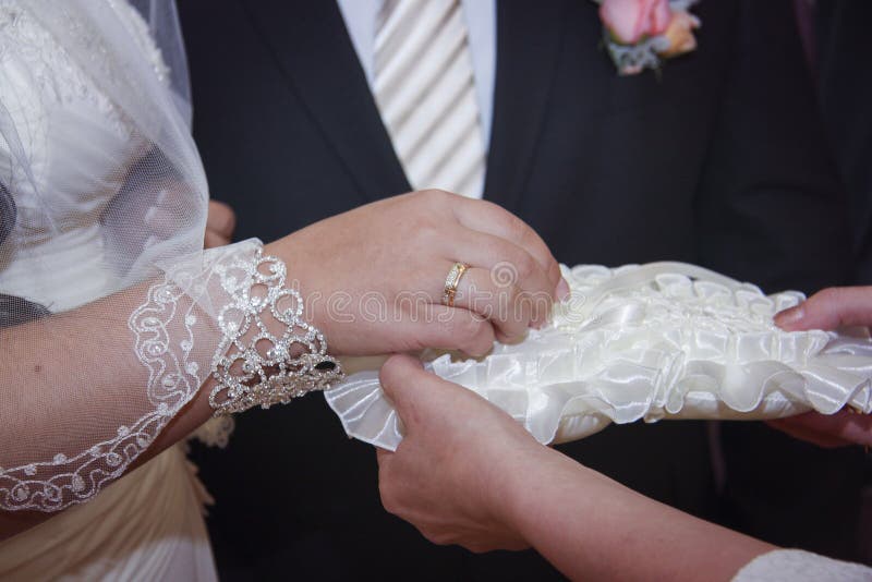 Bride and groom exchanging wedding rings stock photo Bride and groom exchanging wedding rings stock photo