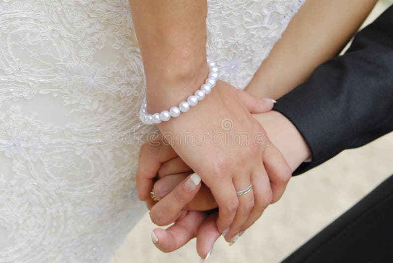 Bride and groom hands