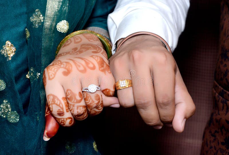 bride groom hands holding showing wedding jewelry rings bride groom hands holding showing wedding jewelry rings 235241371