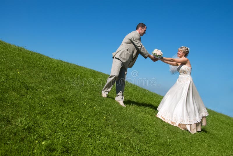 Bride and groom on the hill