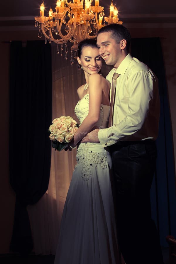 Bride and groom kissing stock image