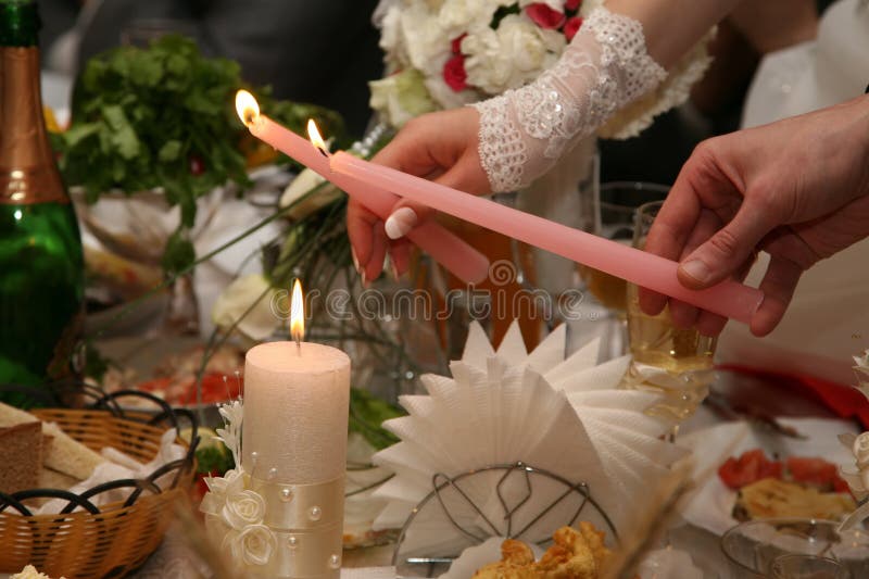 Bride and Groom Light the Wedding Candle at the Ceremony Stock Image