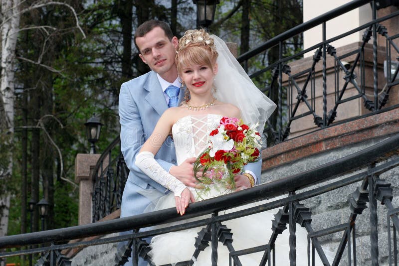 Bride and groom looking at somewhere and smiling