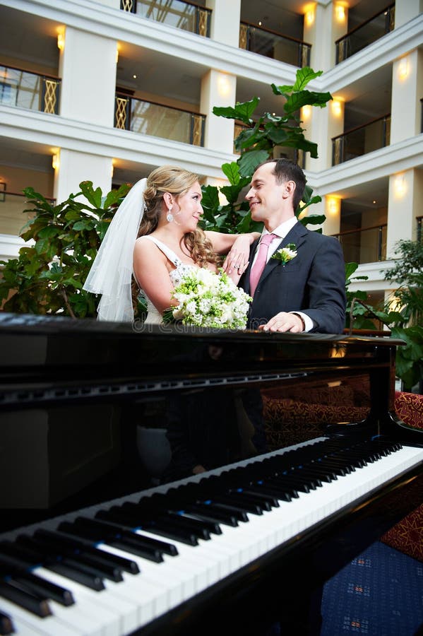 Bride and groom near the piano