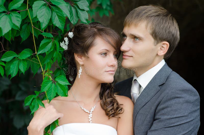 Bride and groom outdoors park closeup portrait stock photo Bride and groom outdoors park closeup portrait stock photo