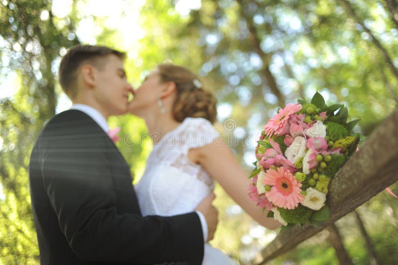 Bride and groom in park