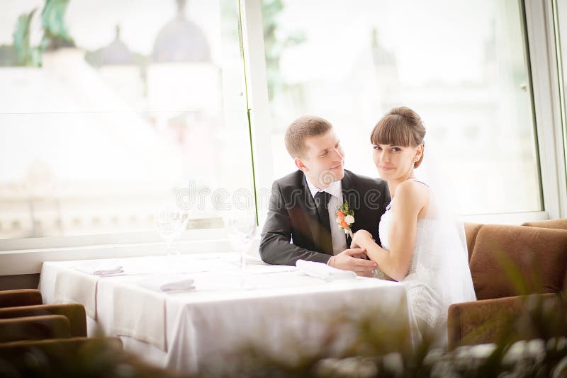 Bride and Groom in Restaurant. Stock Photo Image of backlight, luxury