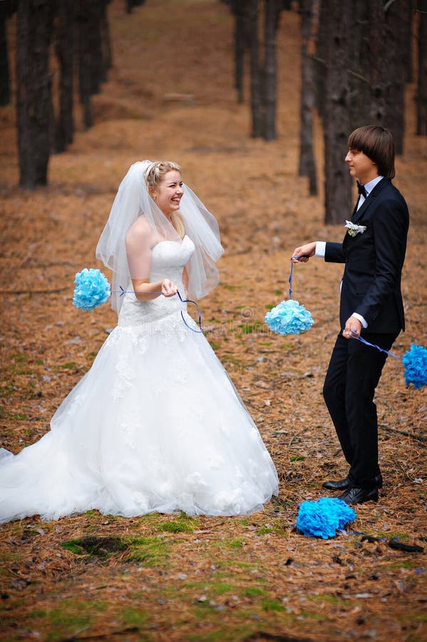 Bride and groom walking in the park at the wedding stock image Bride and groom walking in the park at the wedding stock image