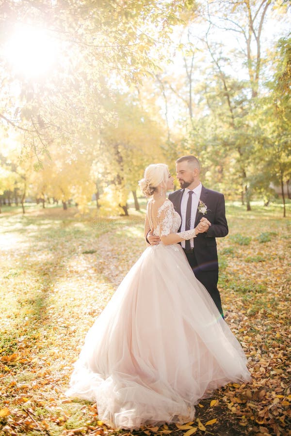 Bride and Groom at wedding Day walking Outdoors