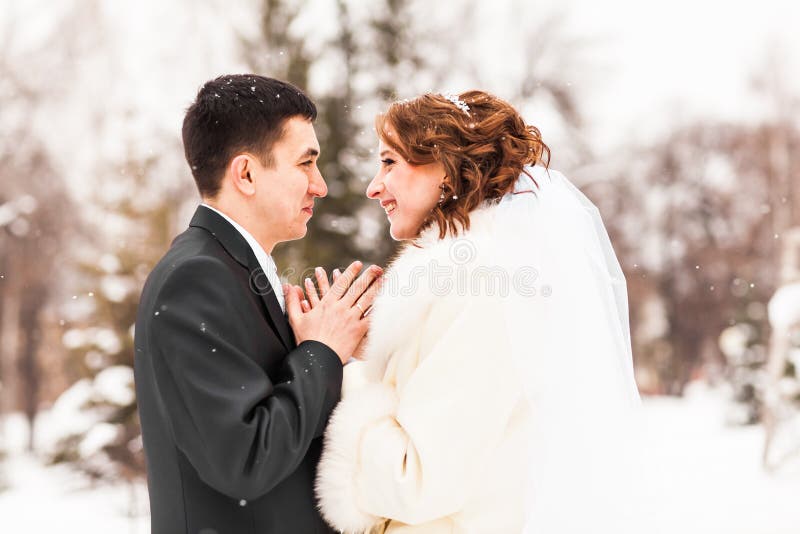 Bride and groom in the winter park