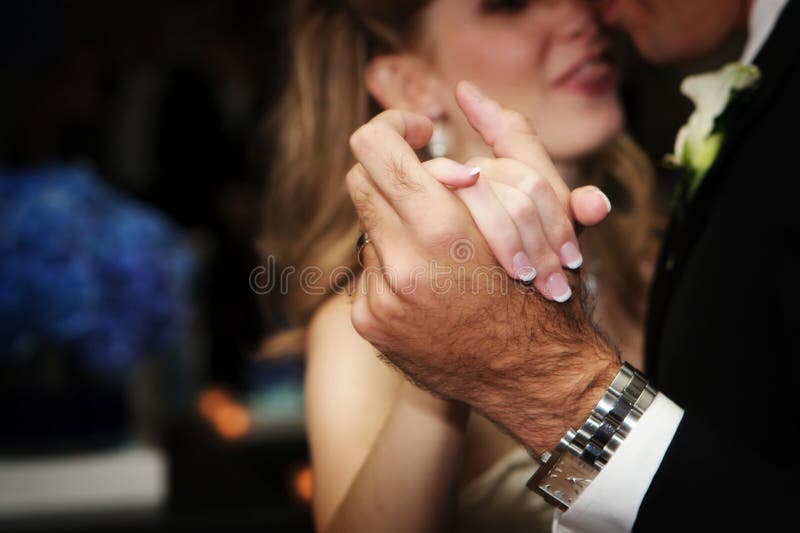 Bride and grroms hands during the first dance