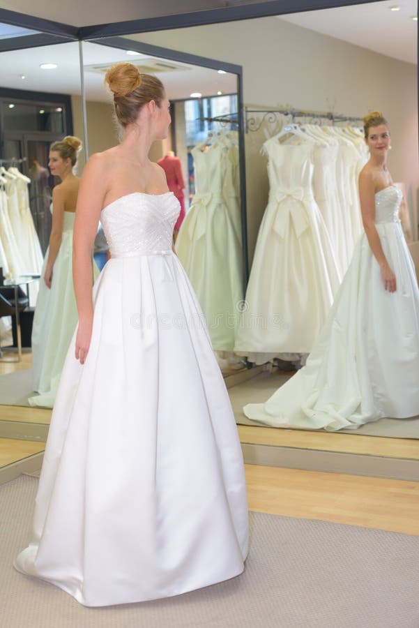 Bride having final fitting stock photo. Image of store 83783512