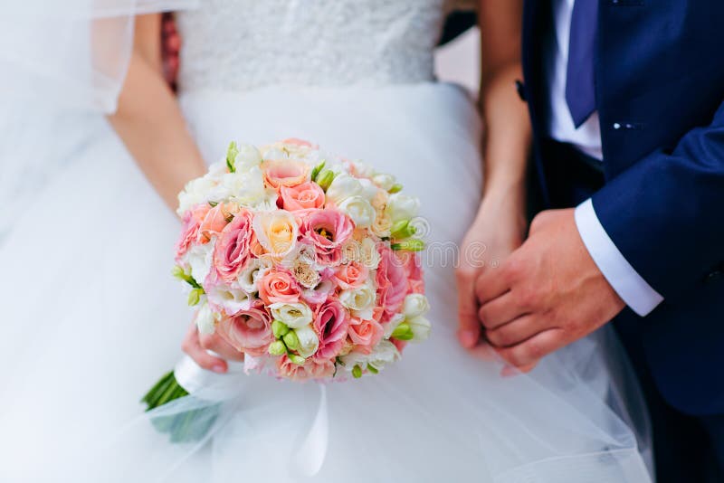 Bride Hold Groom By The Hand And Wedding Bouquet. Focus On Wedding ...